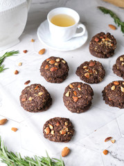 Vegan Almond oatmeal chocolate cookies set in cafe table.