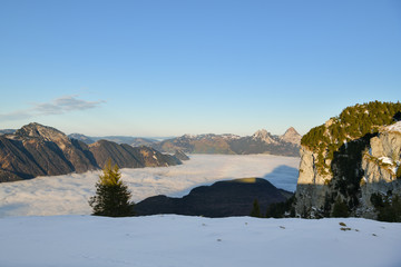 Beautiful view on Swiss Alps and Lake Lucerne covered by dense layer of clouds as seen from Niederbauen above Emmeten