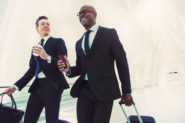 Business rushing down an airport hall for a flight