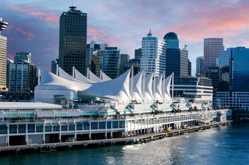 Entering the harbor on a cruise ship in Vancouver at sunrise to see a beautiful city with gorgeous...