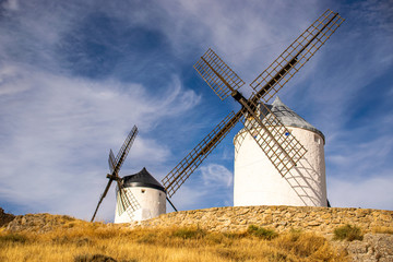 Fototapeta na wymiar Photo of some beautiful and historic windmills located in Consuegra, Toledo, Spain during a sunny day of summer in a natural place. 