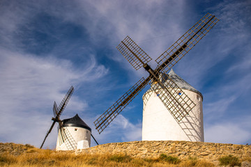 Fototapeta premium Photo of some beautiful and historic windmills located in Consuegra, Toledo, Spain during a sunny day of summer in a natural place. 