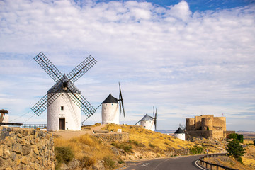 Photo of some beautiful and historic windmills located in Consuegra, Toledo, Spain during a sunny day of summer in a natural place. 