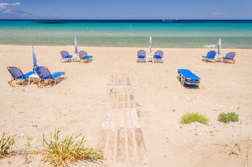 Fototapeta na wymiar Picturesque golden sandy beach in Tsilivi situated on the east of Zakynthos island on Ionian Sea, Greece.