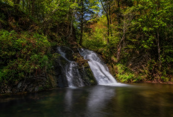 wonderful waterfall on the mountain river Carpathians. Gurkalo or Hurkalo Waterfall, Carpathian Mountains, National Park of Skole Beskydy, Ukraine. autumn 2020. Long exposure shot.