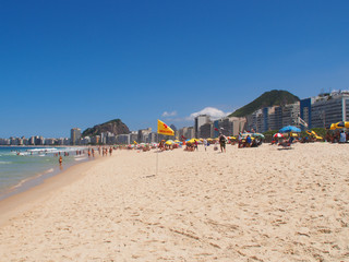 Rio de Janeiro, Brazil - 03/09/2020: sunny day on the coast of the Atlantic ocean, Copacabana beach. Copy space for text.