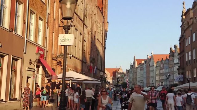 Gdansk, North Poland - August 15, 2020: Time-lapse of People doing leisure activities and dining at city center main square in Trakt Kr&oacute;lewski (Royal Way) in the evening right after covid 19 pandemic