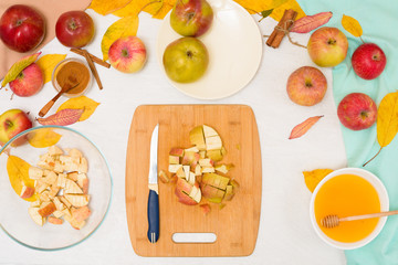 Autumn baking concept. step-by-step recipe for baking a traditional autumn Apple pie, copy the space on a light background. cut apples and mix with cinnamon and sugar