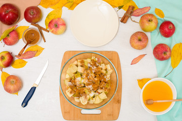Autumn baking concept. step-by-step recipe for baking a traditional autumn Apple pie, copy the space on a light background. cut apples and mix with cinnamon and sugar