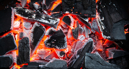 Burning coals in the grill. Fire for cooking. Summer cooking methods. For presentation of outdoor recreation