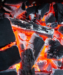 Burning coals in the grill. Fire for cooking. Summer cooking methods. For presentation of outdoor recreation