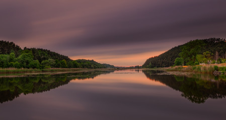 Fantastic beautiful sunset evening view on lake in Stradch, Lviv district. june 2020. Long exposure shot.