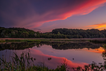 Fantastic beautiful sunset evening view on lake in Stradch, Lviv district. june 2020. Long exposure shot.