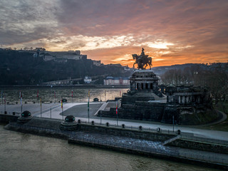 Colorful Sunrise burning sky Koblenz City historic monument German Corner where river rhine and...