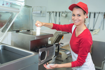 female cook smiling preparing sandwiches