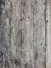 Vertical shot of the surface of old boards. Unpainted pine tree planks background