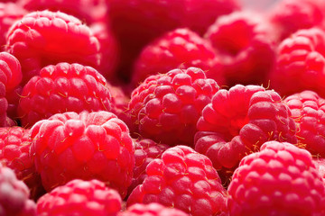 Fresh ripe red raspberries background close-up. Healthy organic food, summer vitamins, BIO viands, natural background. Copy space for your advertising text message