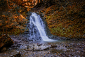 Sopit or Sopot waterfall is located in Ukrainian Carpathians at beauty autumn day. Long exposure shot.