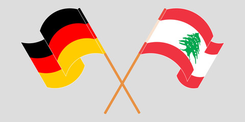 Crossed and waving flags of Lebanon and Germany