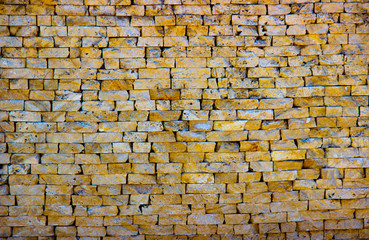 brick wall of yelow color, wide panorama of masonry