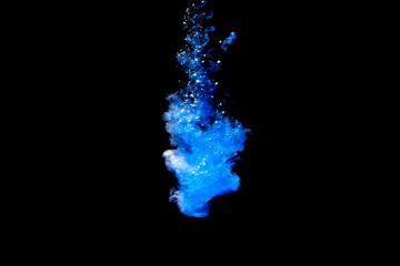 A cloud of blue paint released into clear water. Isolate on a black background.