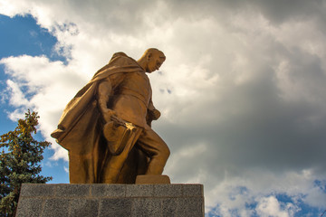 Naklejka premium An old bronze monument to an unknown Soviet soldier who died during the Second World War in the Carpathian Mountains, Ukraine.