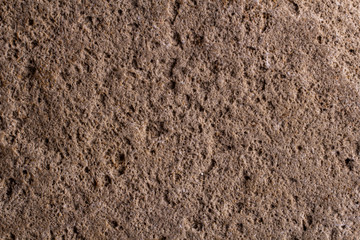 macro grey natural pebble stone texture from the beach