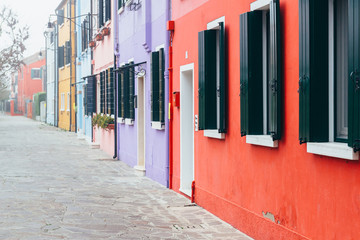 Fototapeta na wymiar Island of Burano, Venice, Italy. Colored houses. Landscape of Burano. Vertical image.