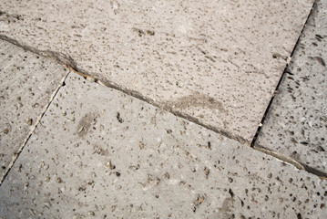 close-up of paving stones made of natural polished porous lava stone