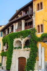 Fototapeta na wymiar Old narrow streets of the city of Torri del Benaco. Northern Italy, Lake Garda
