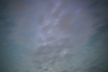Clouds overcast the night sky and interfere with astronomical observations