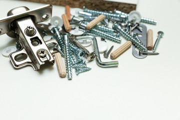 furniture fittings on white background close up. assembling furniture yourself. 