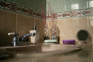 sink faucets of a fully arranged home bathroom