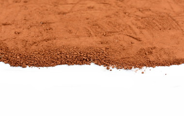 Heap of Red dry clay isolated on white background. Ochre, also spelled ocher, a natural yellow...