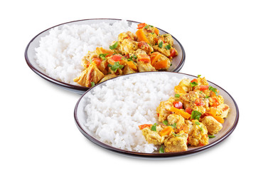 Curry chicken with rice in a plate on a white isolated background
