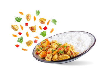 Curry chicken with rice in a plate on a white isolated background