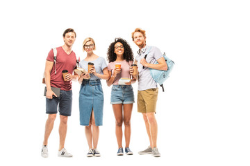 Fototapeta premium Multiethnic students with coffee to go and books looking at camera on white background