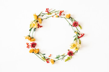 Autumn floral composition. Wreath made of fresh flowers on white background. Autumn, fall concept. Flat lay, top view