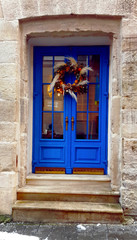 blue door with the christmas wreath
