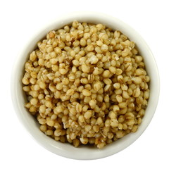 Cooked bulgur wheat isolated on white.