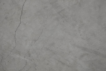 Naklejka premium Beton popękany szary