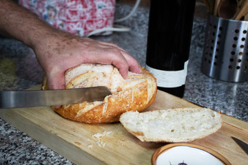 Hand cutting bread