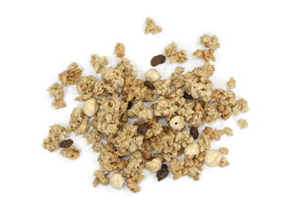 Pile of granola from above isolated on a white background. CRUNCHY hazelnut muesli isolated.