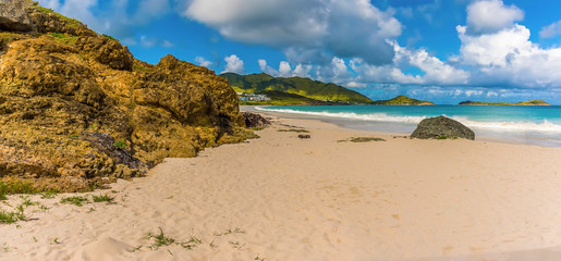 Rocky outcrops amidst the white sands of Orient beach in St Martin