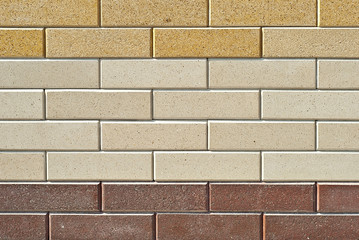 exture of brick wall. new brickwork. Samples of wall or fence are presented at exhibitions. Brown brick close up.