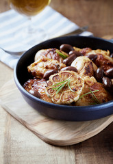 Grilled chicken pieces with kalamata olives and fresh rosemary. 