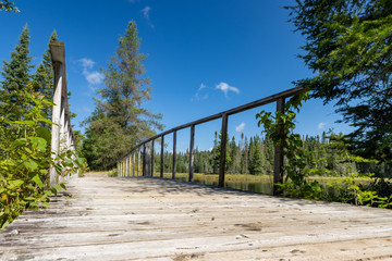 Wooden footbridge on hiking trail along West Rose Lake in Algonquin Provincial Park