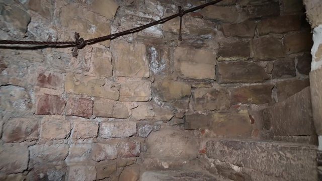 Detail of the old stone steps in the castle. Climbing the spiral staircase.