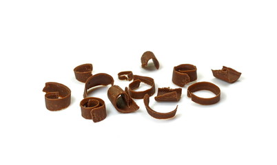 CHOCOLATE ROLL. Chocolate Curls Isolated On White Background. Group of chocolate shavings. 