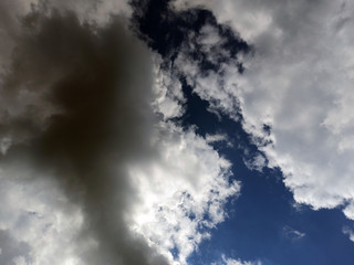 Obraz premium photo of blue sky with white and gray clouds on a summer evening